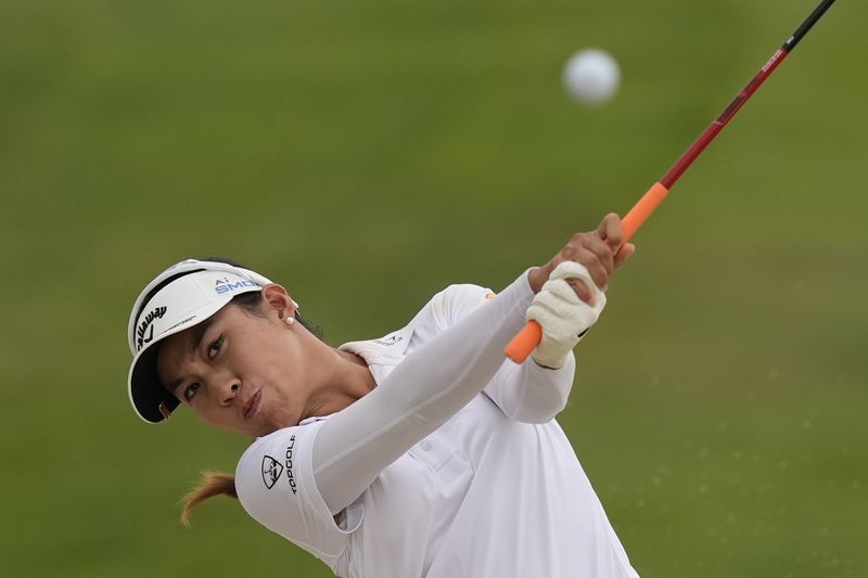 Jeeno Thitikul, of Thailand, hits out of a bunker on the 17th hole during the final round of the LPGA Kroger Queen City Championship golf tournament at TPC River's Bend in Maineville, Ohio, Sunday, Sept. 22, 2024. (AP Photo/Carolyn Kaster)