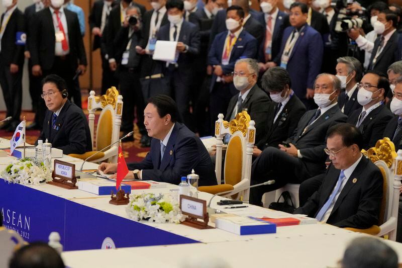 FILE - South Korea's President Yoon Suk Yeol, center, speak as Japan's Prime Minister Fumio Kishida, left, and China's Premier Li Keqiang listen to during the ASEAN Plus Three Summits in Phnom Penh, Cambodia, on Nov. 12, 2022. Leaders of South Korea, China and Japan will meet next week in Seoul for their first trilateral talks since 2019, South Korea's presidential office announced Thursday, May 23, 2024. (AP Photo/Vincent Thian, File)