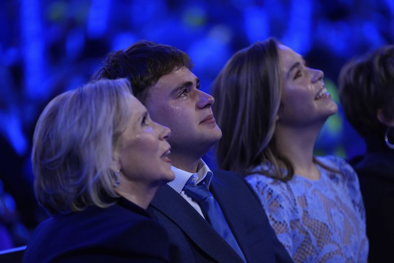 Gwen Walz, Gus Walz and Hope Walz, wife, son and daughter of Democratic vice presidential nominee Minnesota Gov. Tim Walz, watch during the Democratic National Convention Wednesday, Aug. 21, 2024, in Chicago. (AP Photo/Paul Sancya)