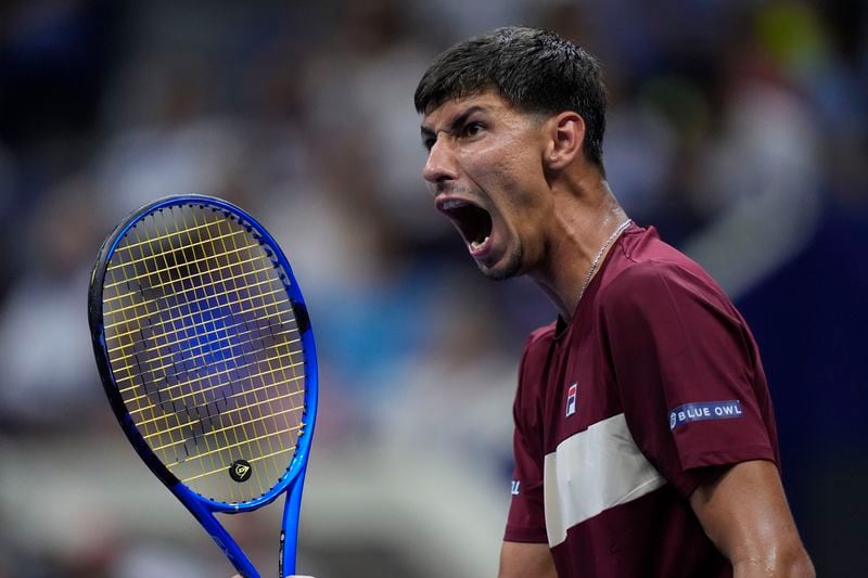 Alexei Popyrin, of Australia, reacts Novak Djokovic, of Serbia,during a third round match of the U.S. Open tennis championships, Friday, Aug. 30, 2024, in New York. (AP Photo/Julia Nikhinson)