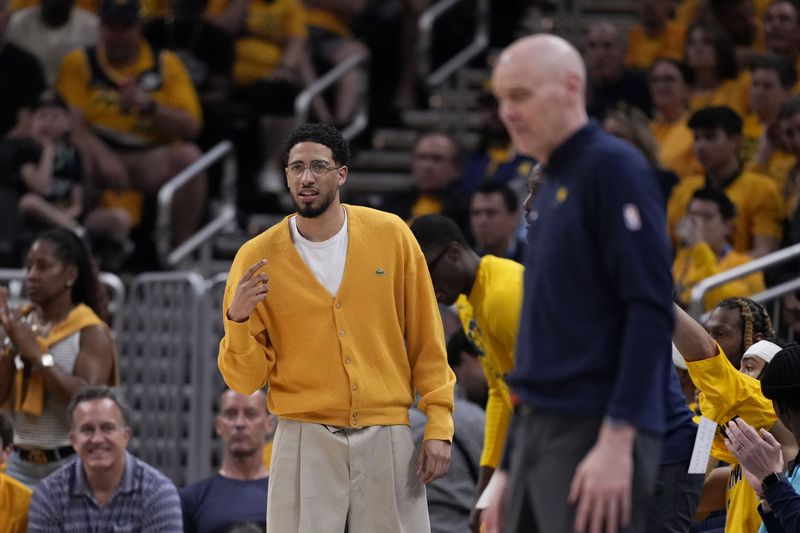 Injured Indiana Pacers guard Tyrese Haliburton watches from the bench during the first half of Game 3 of the NBA Eastern Conference basketball finals against the Boston Celtics, Saturday, May 25, 2024, in Indianapolis. (AP Photo/Michael Conroy)