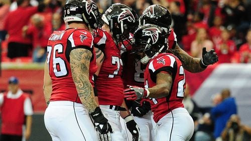 ATLANTA, GA - NOVEMBER 27: Devonta Freeman #24 of the Atlanta Falcons celebrates a touchdown during the first half against the Arizona Cardinals at the Georgia Dome on November 27, 2016 in Atlanta, Georgia. (Photo by Scott Cunningham/Getty Images)