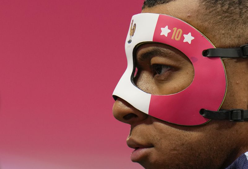 France's Kylian Mbappe wears a face mask as he trains with his teammates during a training session in Leipzig, Germany, Thursday, June 20, 2024. France will play against Netherland during their Group D soccer match at the Euro 2024 soccer tournament on June 21. (AP Photo/Hassan Ammar)