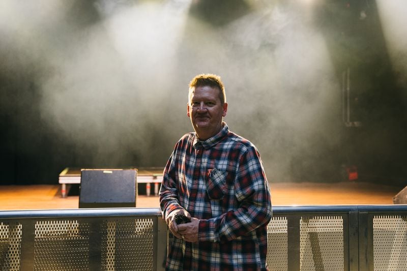 Greg Green, general manager of the Masquerade who has been on staff for 33 years, poses in front of the stage in their space called Hell, on Friday, March 8, 2024. (Olivia Bowdoin for the AJC). 