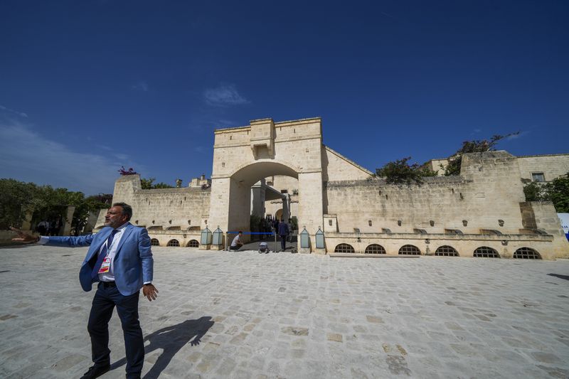 Journalists arrive to Borgo Egnazia luxury complex prior to a G7 world leaders summit at Borgo Egnazia, Italy, Thursday, June 13, 2024. (AP Photo/Luca Bruno)