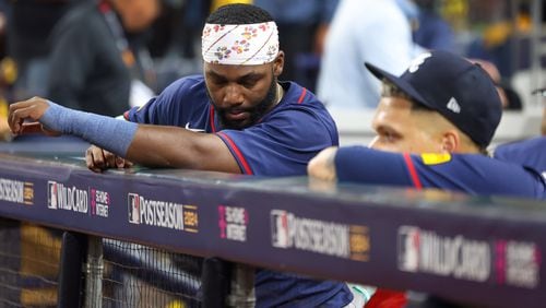 Atlanta Braves outfielder Michael Harris, left, reacts from the dugout with pitcher Joe Jiménez after losing to the San Diego Padres 5-4 in National League Division Series Wild Card Game Two at Petco Park in San Diego on Wednesday, Oct. 2, 2024. The Padres advance to the Division Series to face the Los Angeles Dodgers.  (Jason Getz / Jason.Getz@ajc.com)