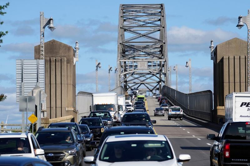 Traffic crosses the Bourne Bridge onto Cape Cod, Friday, Aug. 30, 2024, in Bourne, Mass. (AP Photo/Michael Dwyer)