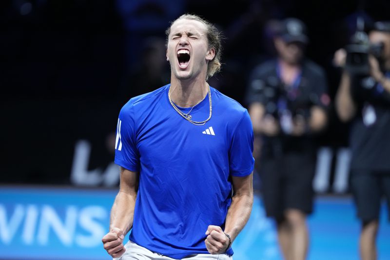 Team Europe's Alexander Zverev celebrates after winning against Team World's Frances Tiafoe on the third day of the Laver Cup tennis tournament, at the Uber arena in Berlin, Germany, Sunday, Sept. 22, 2024. (AP Photo/Ebrahim Noroozi)