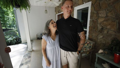 Dale Tingle (left) and Kevin Krüger from Germany interact outside Tingle's home in Watkinsville, Ga. This is the third time Krüger has visited the Tingle family. Thirteen years ago, Tingle donated stem cells to save an anonymous stranger dying of blood cancer. It turned out that stranger was Krüger, who lives thousands of miles away. Now, the two are like family. (Miguel Martinez/AJC)