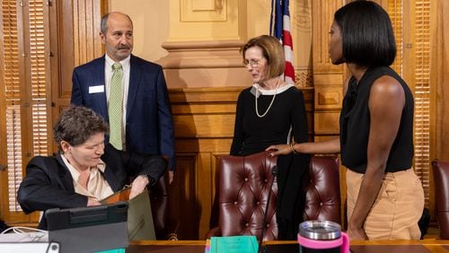 Board member Sara Tindall Ghazal, Chairman John Fervier, member Janice Johnston and member Janelle King speak before the Georgia Election Board meeting Sept. 23 in Atlanta. (Arvin Temkar / AJC)