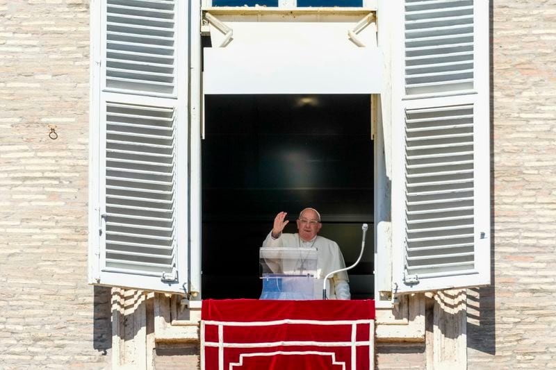 Pope Francis appears at the window of his studio for the traditional noon blessing of faithful and pilgrims gathered in St. Peter's Square at The Vatican, Thursday, Dec. 7, 2006. (AP Photo/Andrew Medichini)