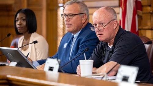 State Election Board member Janelle King, from left, executive director Mike Coan, and board member Rick Jeffares appear at a hastily planned State Election Board meeting Friday, July 12, 2024, at the Geoergia Capitol in Atlanta.(Arvin Temkar / AJC)