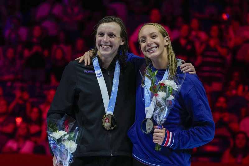Katie Ledecky and Paige Madden celebrate after the Women's 800 freestyle finals Saturday, June 22, 2024, at the US Swimming Olympic Trials in Indianapolis. (AP Photo/Michael Conroy)