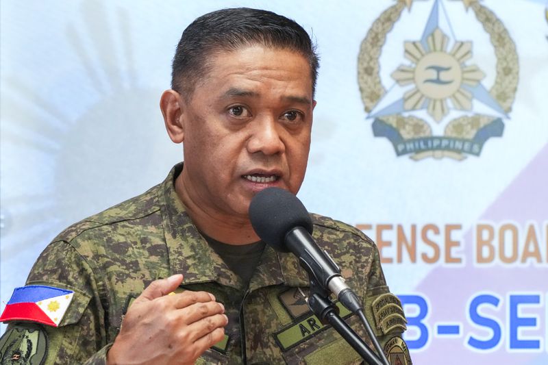 Philippine military chief Gen. Romeo Brawner Jr.,answers questions from reporters during a press conference on the Mutual Defense Board-Security Engagement Board held at the Philippine Military Academy in Baguio, northern Philippines on Thursday, Aug. 29, 2024. (AP Photo/Aaron Favila)