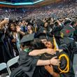 FILE - UCLA students celebrate during a commencement ceremony inside Pauley Pavilion on UCLA campus, in Los Angeles, June 14, 2024. (AP Photo/Damian Dovarganes, File)