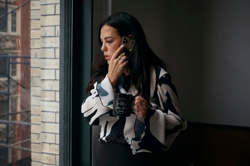 Entrepreneur Becky Litvintchouk makes a call at a co-working space on Monday, Aug. 12, 2024, in New York. (AP Photo/Andres Kudacki)