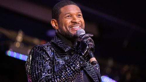 Usher speaks during a homecoming rally at Clark Atlanta University in Atlanta on Feb. 14, 2024. Along with other honors, Amazon presented a $25,000 donation to Usher's New Look Foundation. (Arvin Temkar/The Atlanta Journal-Constitution/TNS)