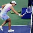 Iga Świątek, of Poland hits the net with her racquet after losing a point to Jessica Pegula, of the United States during the quarterfinals of the U.S. Open tennis championships, Wednesday, Sept. 4, 2024, in New York. (AP Photo/Adam Hunger)