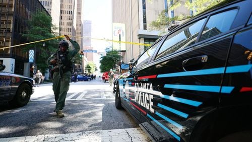 Police work the scene where four people, including a suspect, were injured Tuesday, June 11, 2024, during a shooting in a busy downtown Atlanta food court. (Miguel Martinez/AJC)