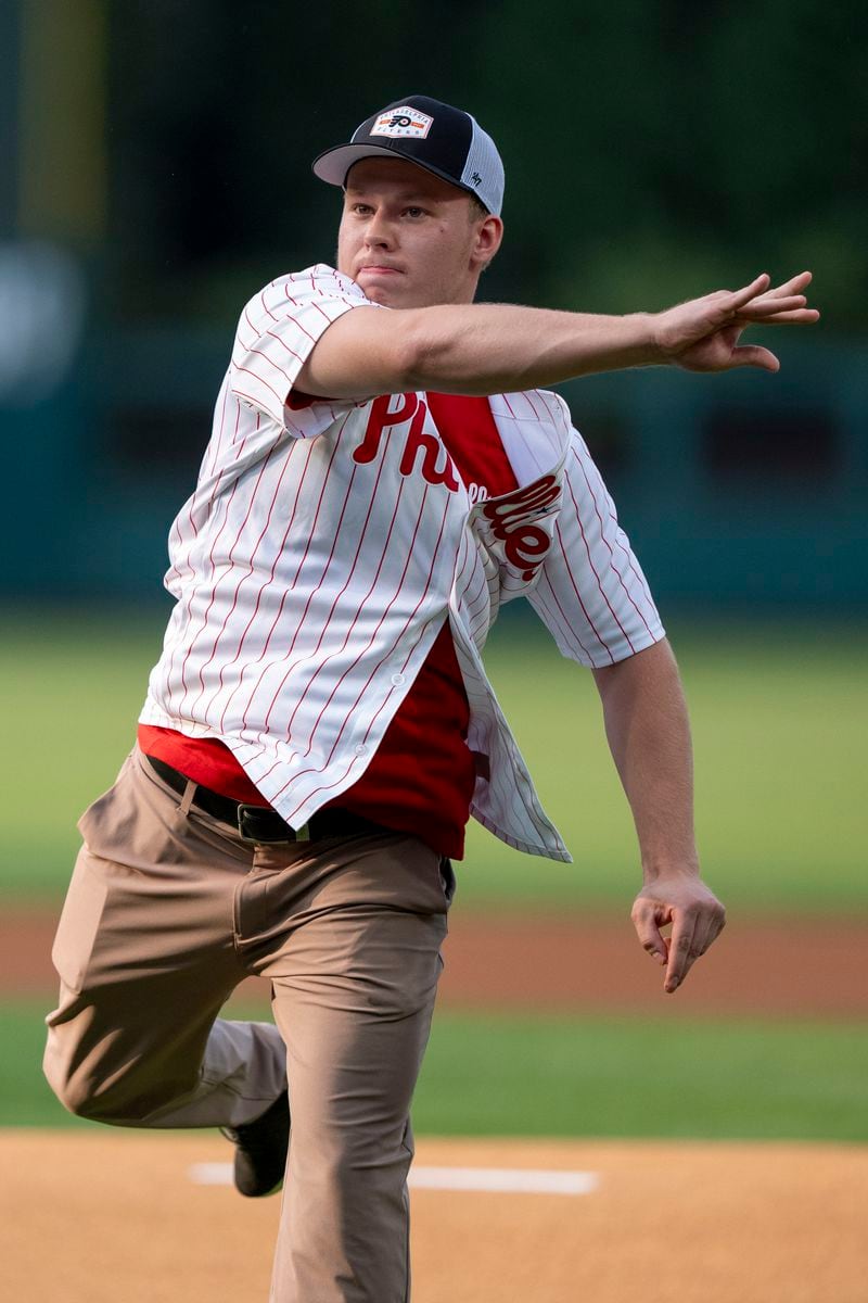 FILE - Philadelphia Flyers Matvei Michkov throws the first pitch prior to the baseball game between the New York Yankees and the Philadelphia Phillies, Monday, July 29, 2024, in Philadelphia. (AP Photo/Chris Szagola, File)