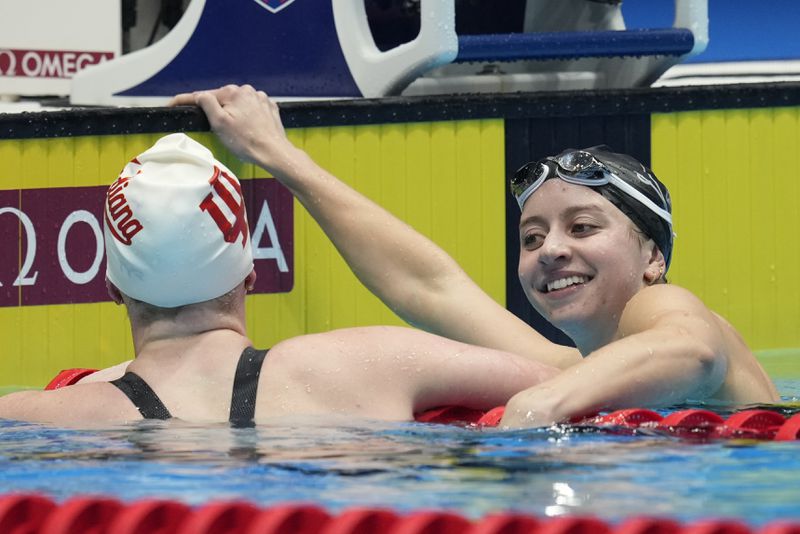 Kate Douglass and Lilly King celebrate after the Women's 200 breaststroke finals Thursday, June 20, 2024, at the US Swimming Olympic Trials in Indianapolis. (AP Photo/Darron Cummings)