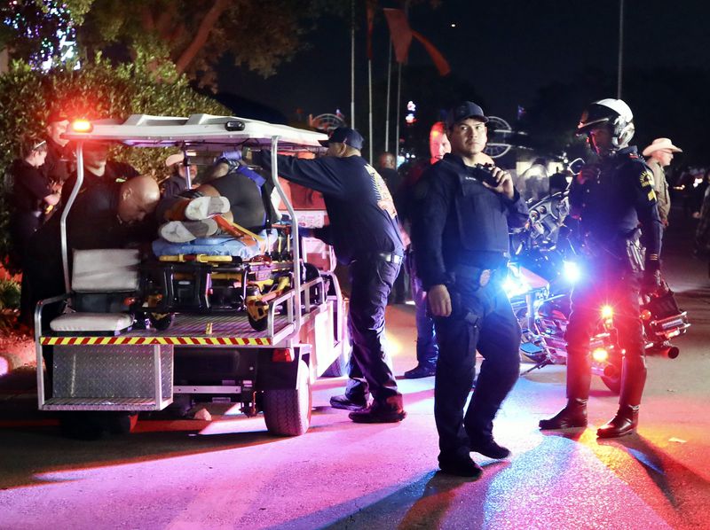 FILE - Dallas Fire-Rescue EMS loads one of the wounded onto a cart after a shooting at the State Fair of Texas on Saturday night, Oct. 14, 2023, in Dallas. (Jason Janik/The Dallas Morning News via AP)