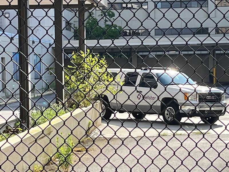 A lone security vehicle was one of the few signs of life at the shuttered Atlanta Medical Center on a recent afternoon. The hospital’s closure has pushed policymakers to devise ways to improve access to care in the city.