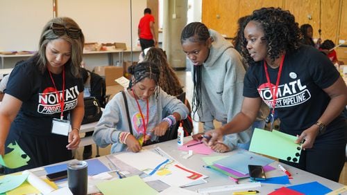 NOMA Atlanta member Crysta Hailes (left) and chapter President Tulia Scott work with students during the 2024 summer camp at Georgia Tech. Courtesy