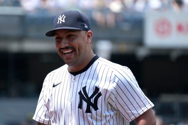 New York Yankees' Nestor Cortes smiles after striking out all batters during the first inning of a baseball game against the Atlanta Braves, Sunday, June 23, 2024, in New York. (AP Photo/Pamela Smith)