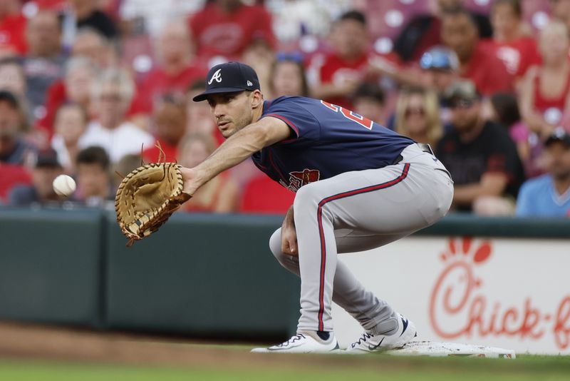 Atlanta Braves first baseman Matt Olson catches the ball to get Cincinnati Reds' Ty France out during the second inning of a baseball game, Wednesday, Sept. 18, 2024, in Cincinnati. (AP Photo/Jay LaPrete)