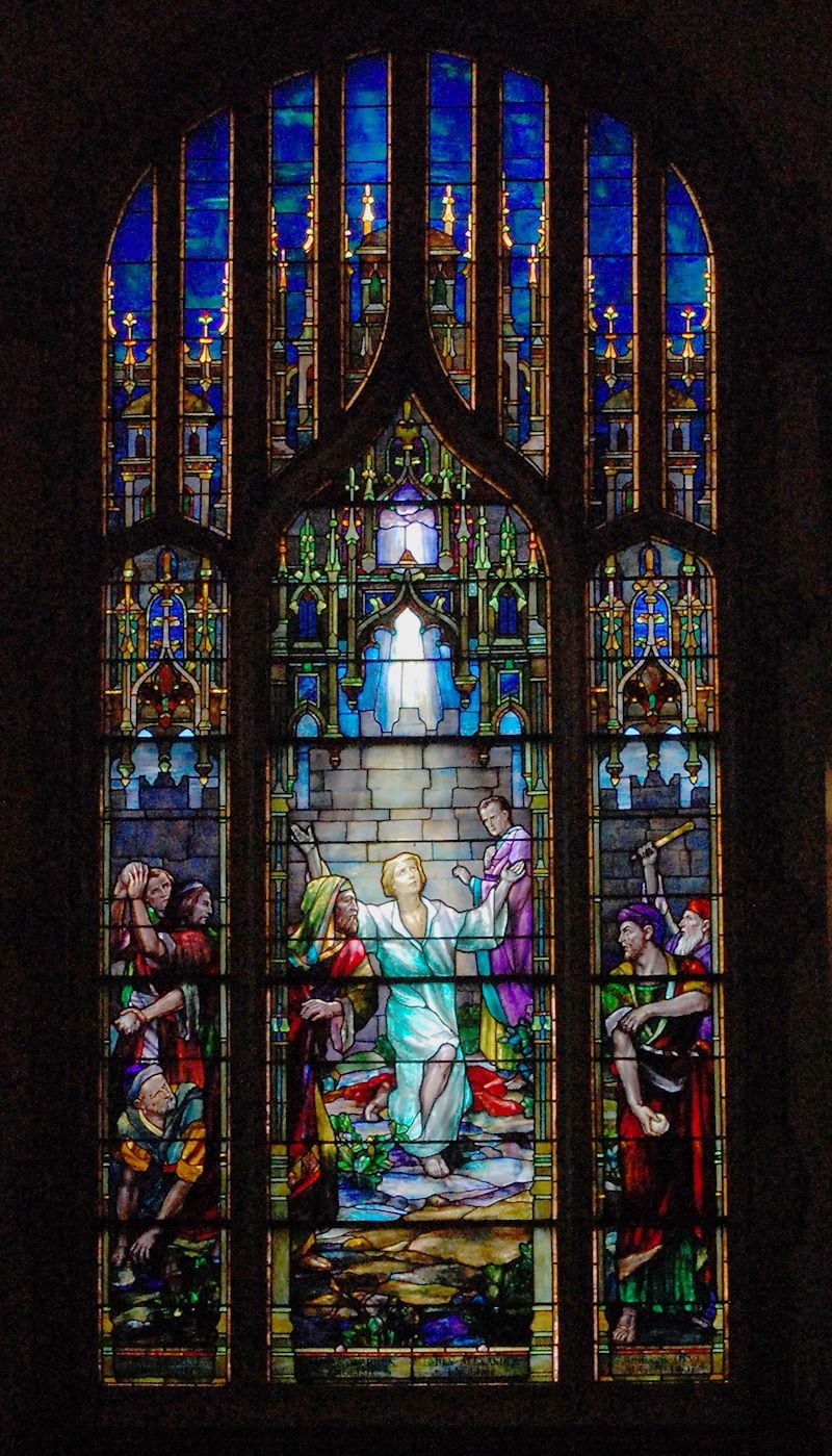 The "Martyrs" window at First Presbyterian Church of Atlanta is by D'Ascenzo and depicts the stoning of Stephen outside the walls of Jerusalem. The men in the left and right panels are throwing the stones.