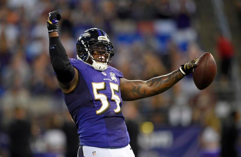 FILE - In this Aug. 29, 2015, file photo, Baltimore Ravens outside linebacker Terrell Suggs celebrates after intercepting a pass by Washington Redskins quarterback Kirk Cousins during a preseason NFL football game in Baltimore. (AP Photo/Nick Wass, File)