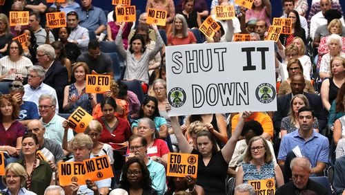 August 19, 2019 Marietta: Many area residents hold signs in opposition as Cobb officials and environmental regulators hold a town hall and community forum in the wake of reports that Cobb and Fulton have high levels of carcinogenic gas on Monday, August 19, 2019, in Marietta. A user and emitter of the gas, Sterigenics, which sterilizes medical equipment, operates in the area.  Curtis Compton/ccompton@ajc.com