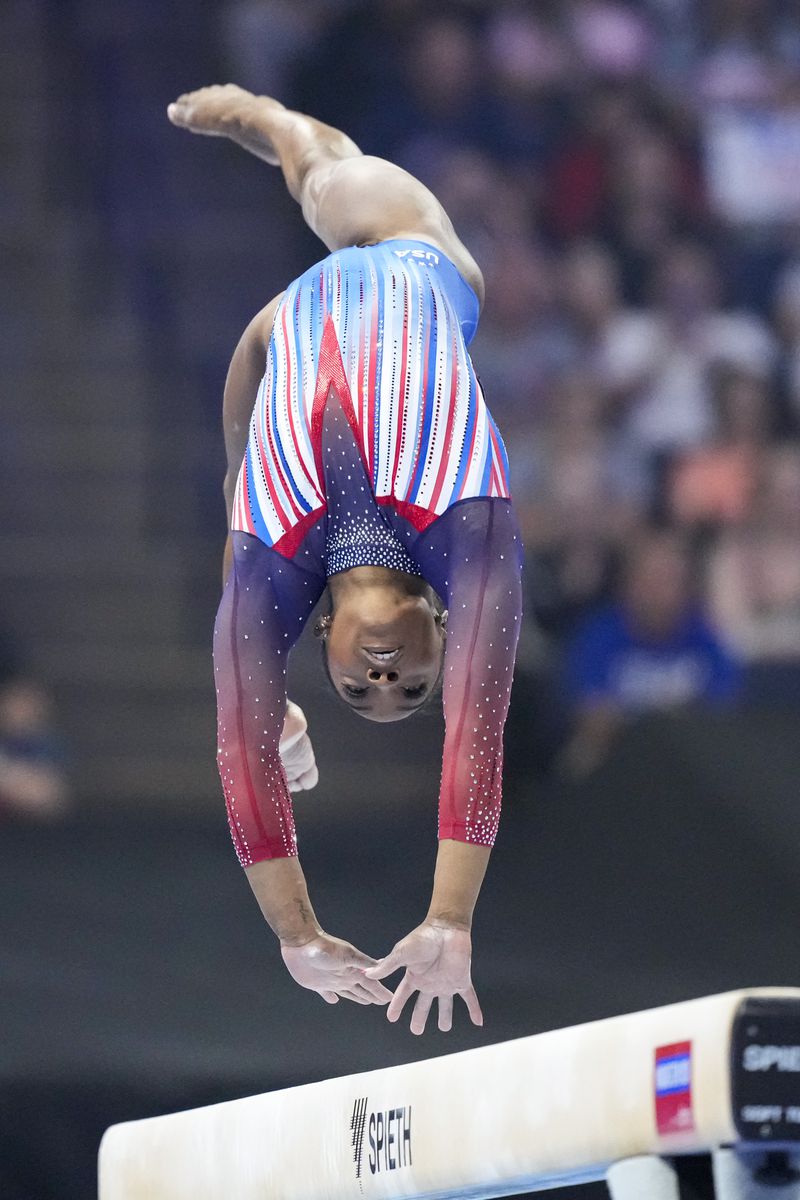 Simone Biles competes on the balance beam at the United States Gymnastics Olympic Trials on Sunday, June 30, 2024, in Minneapolis. (AP Photo/Charlie Riedel)