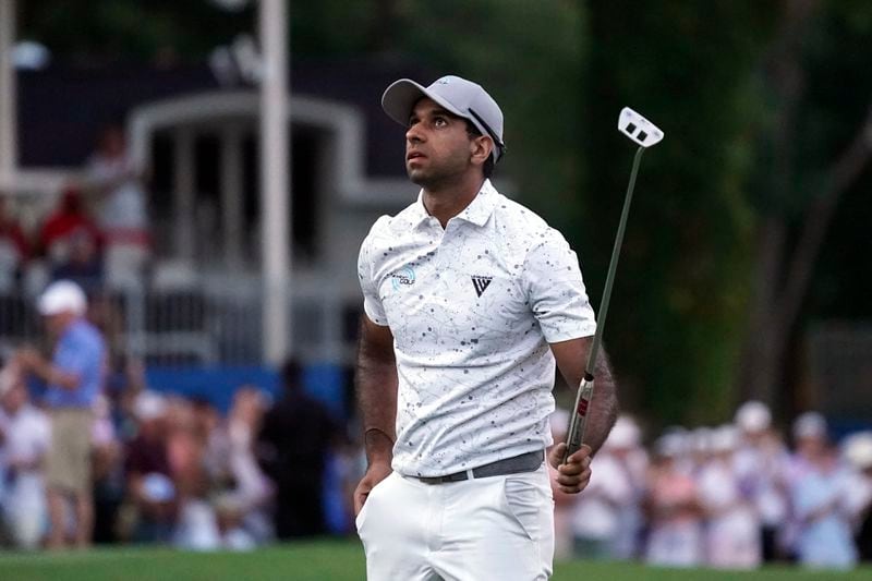 Aaron Rai, of England, reacts on the 18th hole after winning the Wyndham Championship golf tournament in Greensboro, N.C., Sunday, Aug. 11, 2024. (AP Photo/Chuck Burton)