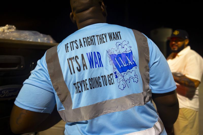 Longshoremen strike at midnight at Bayport Terminal on Tuesday, Oct. 1, 2024, in Houston. (AP Photo/Annie Mulligan)