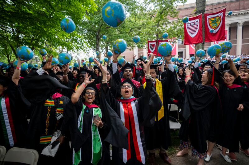 Students celebrate during commencement in Harvard Yard at Harvard University, in Cambridge, Mass., Thursday, May 23, 2024. (AP Photo/Ben Curtis)