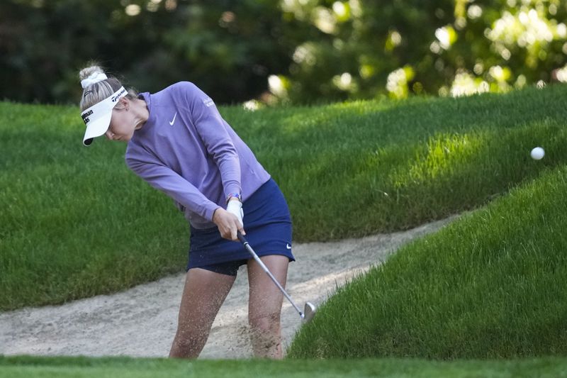Nelly Korda hits from the bunker on the 16th hole during the first round of the Women's PGA Championship golf tournament at Sahalee Country Club, Thursday, June 20, 2024, in Sammamish, Wash. (AP Photo/Gerald Herbert)