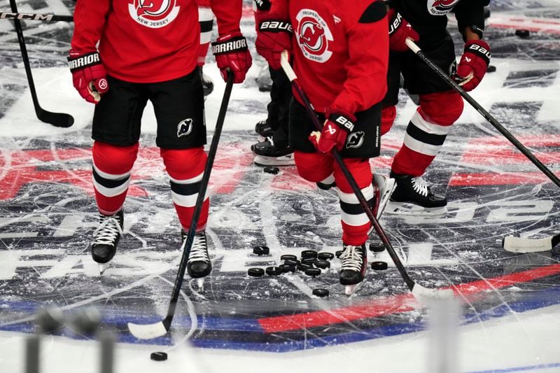 New Jersey Devils' attend a practice session, a day before their NHL hockey game against Buffalo Sabres, in Prague, Czech Republic, Thursday, Oct. 3, 2024. (AP Photo/Petr David Josek)