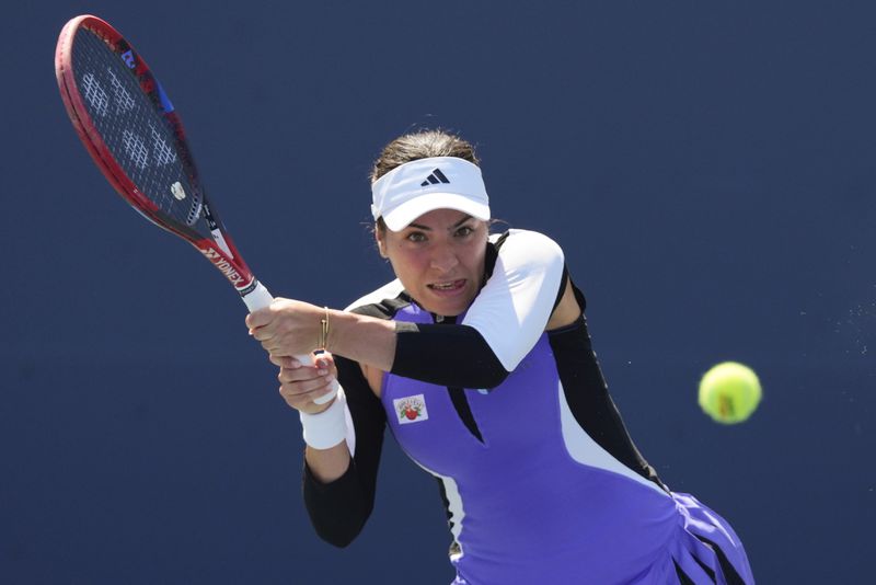 Elena-Gabriela Ruse, of Romania, returns a shot to Barbora Krejcikova, of the Czech Republic, during the first round of the U.S. Open tennis championships, Wednesday, Aug. 28, 2024, in New York. (AP Photo/Kirsty Wigglesworth)