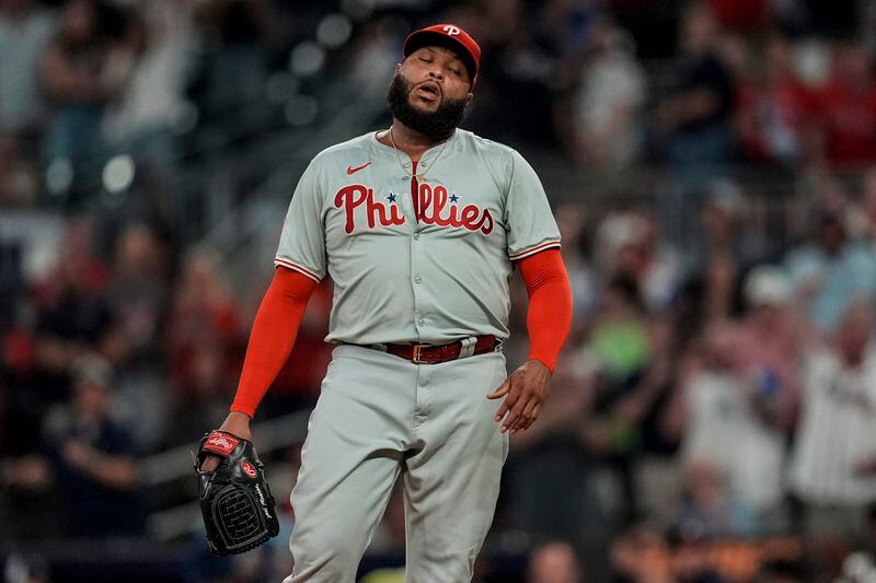 Philadelphia Phillies pitcher José Alvarado (46) reacts to walking a against the Atlanta Braves player during the eighth inning of a baseball game, Tuesday, Aug. 20, 2024, in Atlanta. (AP Photo/Mike Stewart)