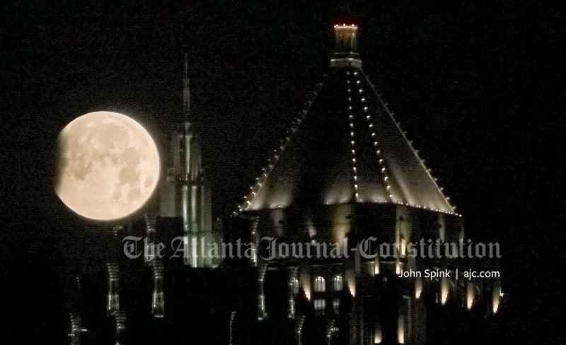 A super moon is visible Wednesday in the night sky above Midtown Atlanta.