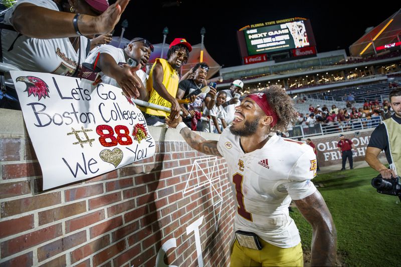 Boston College quarterback Thomas Castellanos (1) celebrates with fans after his team defeated Florida State in an NCAA college football game, Monday, Sept. 2, 2024, in Tallahassee, Fla. (AP Photo/Colin Hackley)