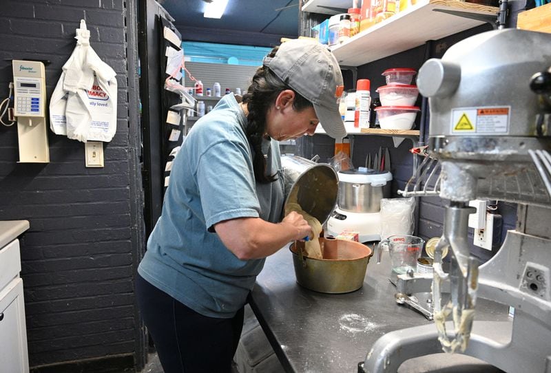 Nikki Bryant, independent pharmacist and owner, makes a pound cake at her pharmacy in rural Cuthbert, Georgia, Adams Family Pharmacy. She is now selling baked goods and coffee at her pharmacy in order to keep from going out of business. (Hyosub Shin / AJC)