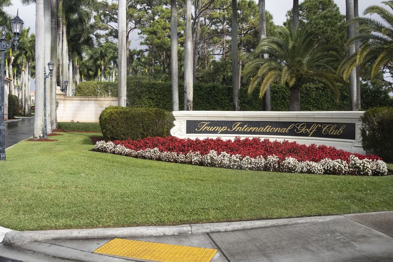 FILE - The motorcade for President Donald Trump arrives at Trump International Golf Club, Feb. 15, 2020, in West Palm Beach, Fla. (AP Photo/Alex Brandon, File)