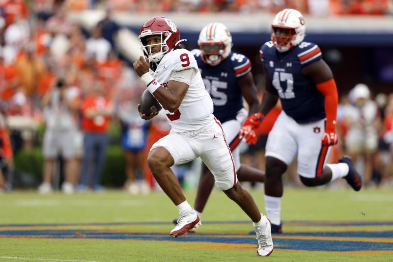 Oklahoma quarterback Michael Hawkins Jr. (9) breaks free for a touchdown against Auburn during the first half of an NCAA college football game, Saturday, Sept. 28, 2024, in Auburn, Ala. (AP Photo/Butch Dill)