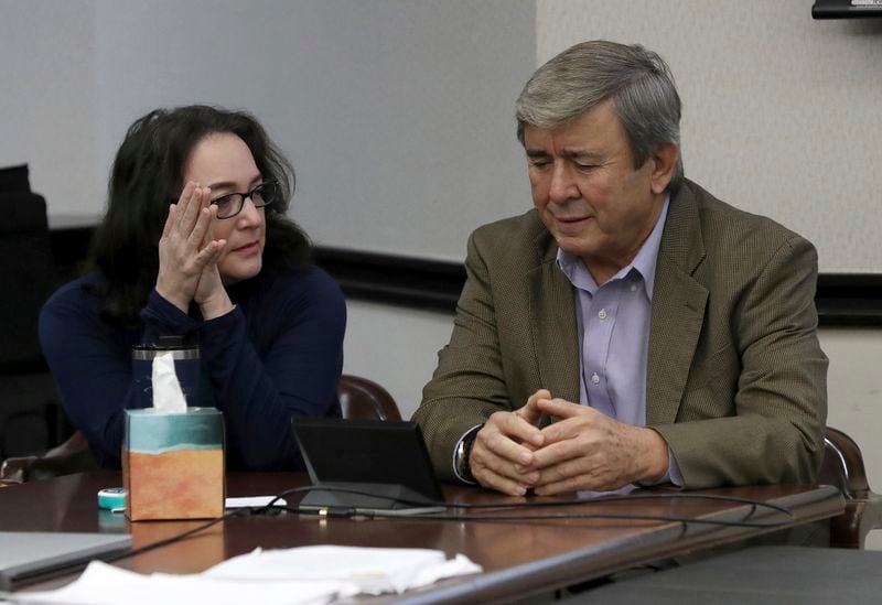 Rose Marie Kosmetatos, left, and her husband, Antonios Pagourtzis, parents of accused Santa Fe High School shooter Dimitrios Pagourtzis, talk before the start of the civil trial against them Friday, Aug. 16, 2024, in Galveston County Court No. 3 Judge Jack Ewing's courtroom at the Galveston County Courthouse in Galveston, Texas. (Jennifer Reynolds/The Galveston County Daily News via AP, Pool)