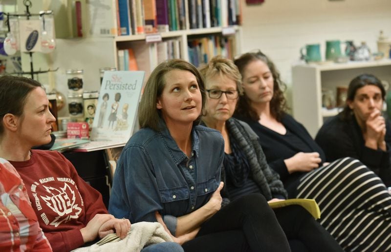 Meridith Mason-Ward pauses as she shares her thoughts during a monthly Race-Conscious Parenting Collective meeting at Charis Books and More. HYOSUB SHIN / HSHIN@AJC.COM