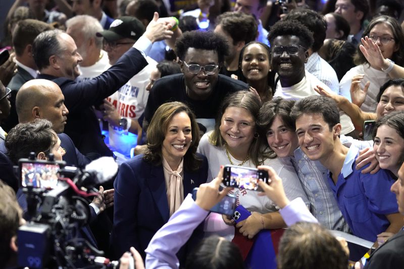 FILE - Democratic presidential nominee Vice President Kamala Harris poses for a photo with supporters at a campaign rally in Philadelphia, Aug. 6, 2024. (AP Photo/Matt Rourke, File)