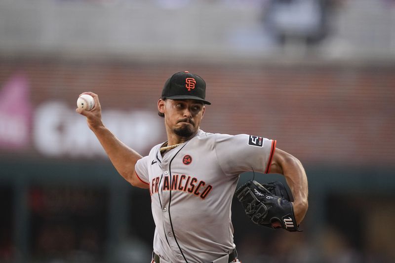 San Francisco Giants pitcher Jordan Hicks (12) delivers in the first inning of a baseball game against the Atlanta Braves, Wednesday, July 3, 2024, in Atlanta. (AP Photo/Brynn Anderson)
